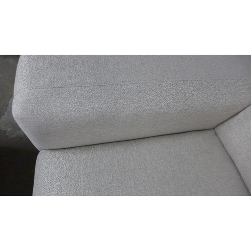 1442 - A sandstone weave three seater sofa