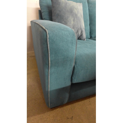 1443 - A turquoise corded two seater sofa