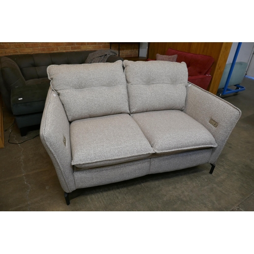 1490 - An oatmeal upholstered electric reclining two seater sofa