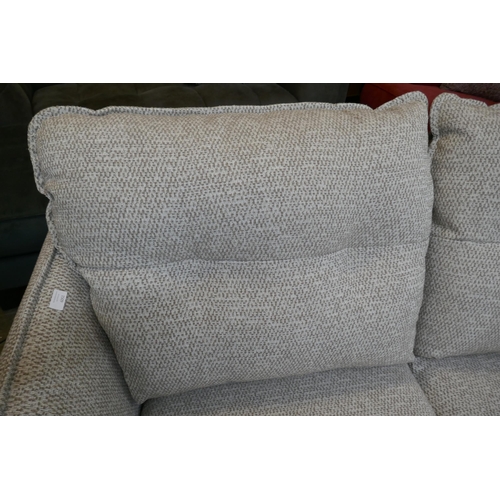 1490 - An oatmeal upholstered electric reclining two seater sofa