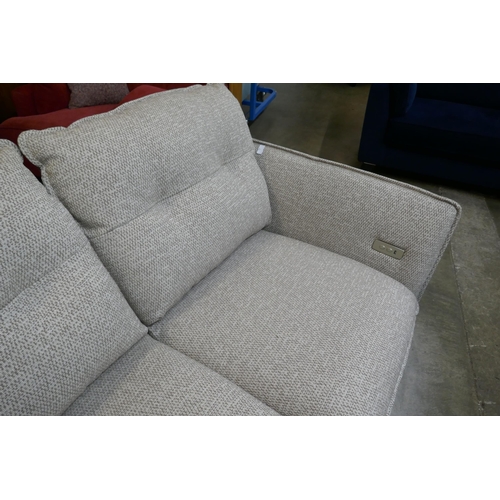 1490 - An oatmeal upholstered electric reclining two seater sofa