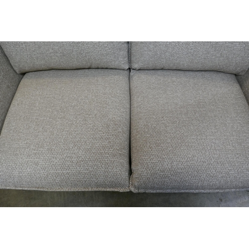 1490 - An oatmeal upholstered electric reclining two seater sofa