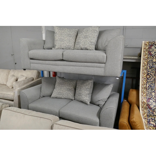 1505 - A pair of grey upholstered three seater sofas