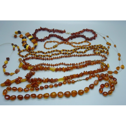 1004 - A collection of eight amber bead necklaces and a bracelet