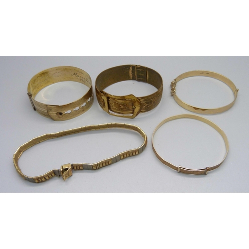 1006 - Three rolled gold bangles, one other bangle and a bracelet