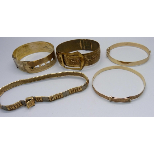 1006 - Three rolled gold bangles, one other bangle and a bracelet