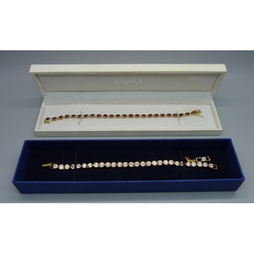 1010 - A silver gilt stone set bracelet and a Swarovski line bracelet