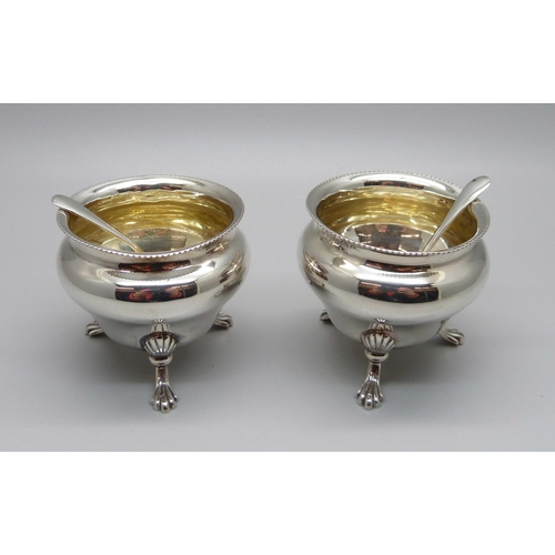 1014 - A pair of silver salts and a pair of silver salt spoons, 65g