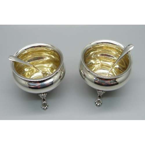 1014 - A pair of silver salts and a pair of silver salt spoons, 65g