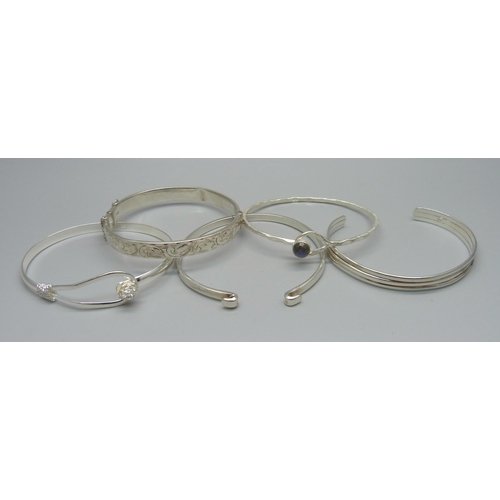 1023 - Five silver bangles, 57g