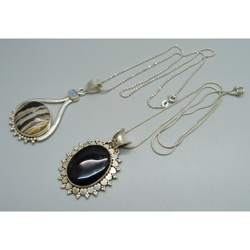 1025 - Two silver pendants and chains