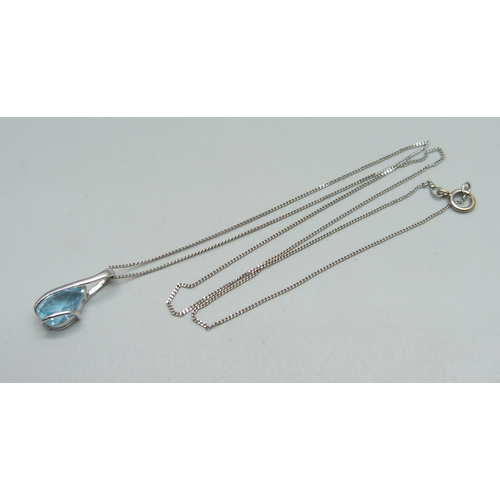 1042 - A 9ct white gold and blue stone pendant on a 9ct white gold chain, 2.1g, chain 46cm