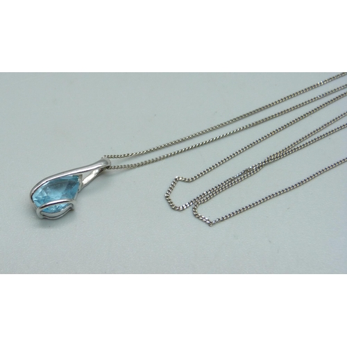 1042 - A 9ct white gold and blue stone pendant on a 9ct white gold chain, 2.1g, chain 46cm