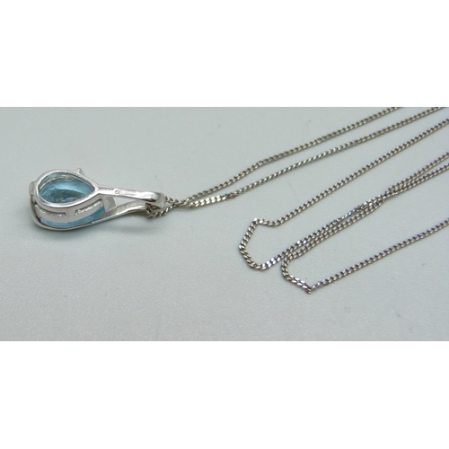 1042 - A 9ct white gold and blue stone pendant on a 9ct white gold chain, 2.1g, chain 46cm