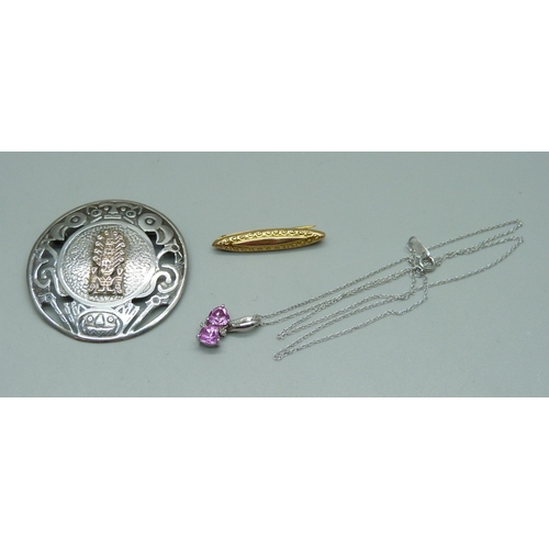 1047 - A 9ct white gold and pink gemstone pendant on a fine 9ct gold chain, 1.7g, a 9ct gold bar brooch, 0.... 