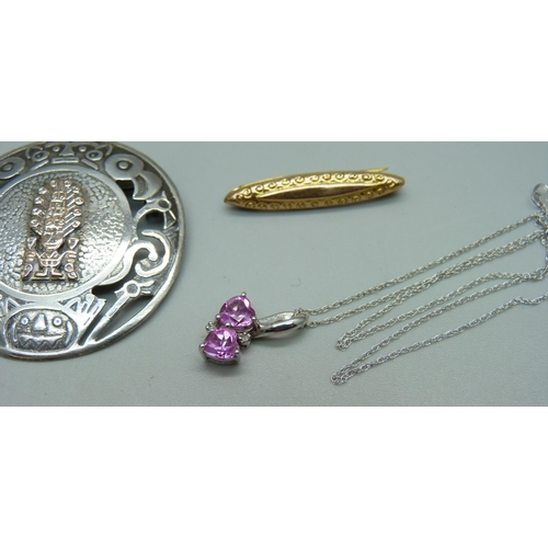 1047 - A 9ct white gold and pink gemstone pendant on a fine 9ct gold chain, 1.7g, a 9ct gold bar brooch, 0.... 