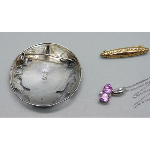 1047 - A 9ct white gold and pink gemstone pendant on a fine 9ct gold chain, 1.7g, a 9ct gold bar brooch, 0.... 