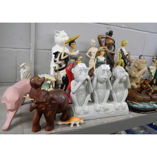 1071 - A collection of animal figures including Kung-Fu pig, a Neapolitan figure of a cobbler, a/f, a figur... 