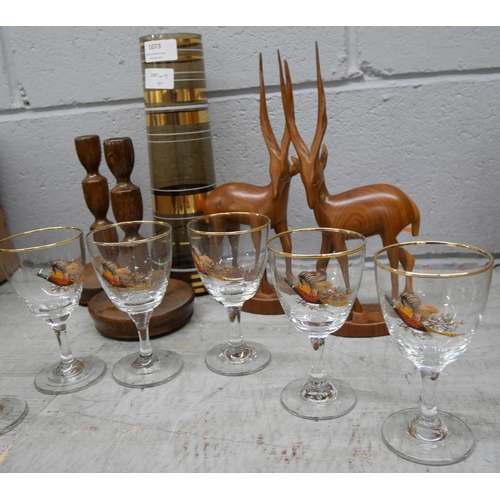 1073 - Six game bird drinking glasses, a retro glass vase, a pair of oak candlesticks and two carved figure... 