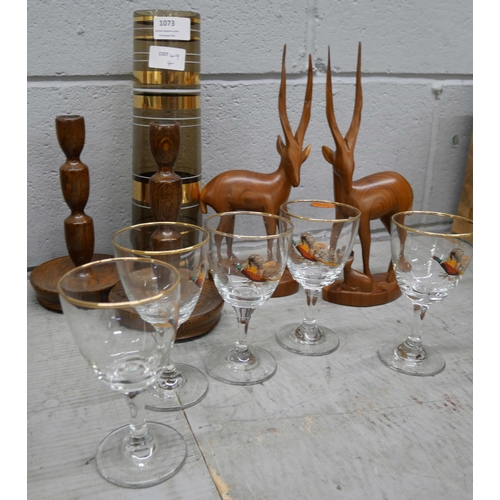 1073 - Six game bird drinking glasses, a retro glass vase, a pair of oak candlesticks and two carved figure... 