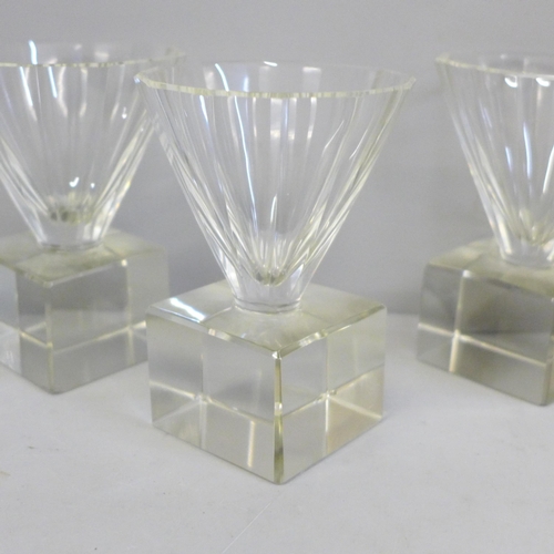 630 - Four heavy crystal glass liqueur glasses, signatures worn and each base chipped