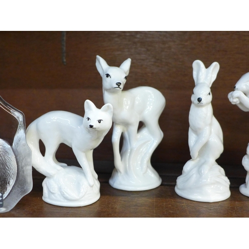 643 - A collection of Crown Staffordshire animals, squirrel a/f (cracked), a USSR model stoat and two Swed... 