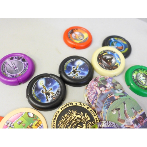 645 - A collection of Pogs and Lego Technic throwing disks
