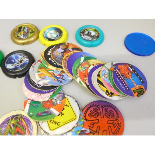 645 - A collection of Pogs and Lego Technic throwing disks