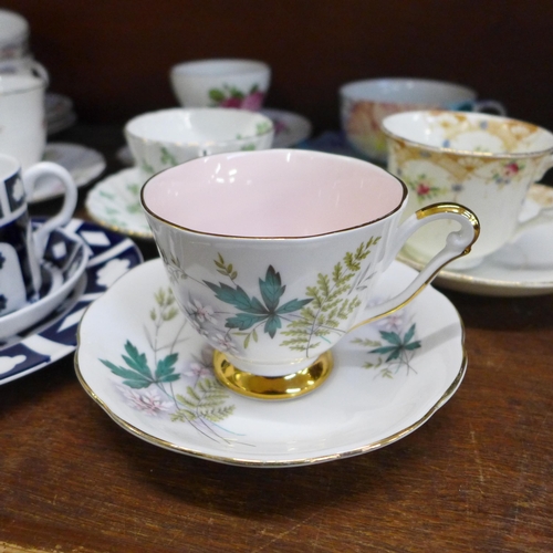 658 - A collection of tea cups and saucers including Royal Crown Derby Unfinished pattern, Royal Worcester... 