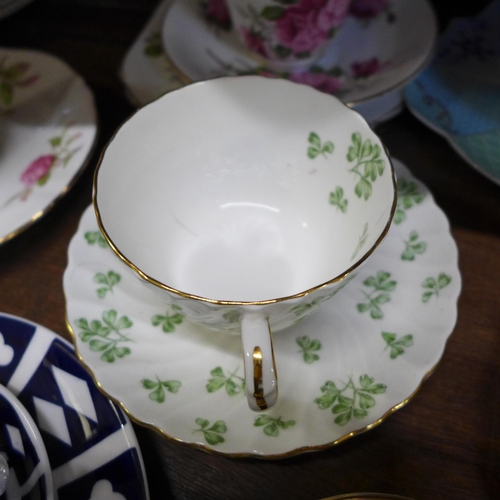 658 - A collection of tea cups and saucers including Royal Crown Derby Unfinished pattern, Royal Worcester... 