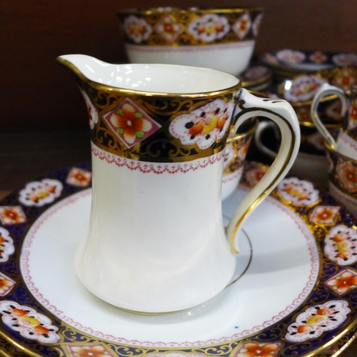 661 - A Royal Albert twelve setting tea service, with sugar bowl, cream jug and two sandwich plates **PLEA... 