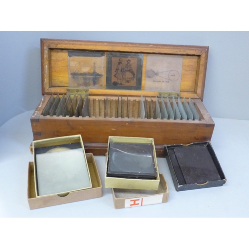 675 - A wooden case of lantern slides and three boxes of lantern slides