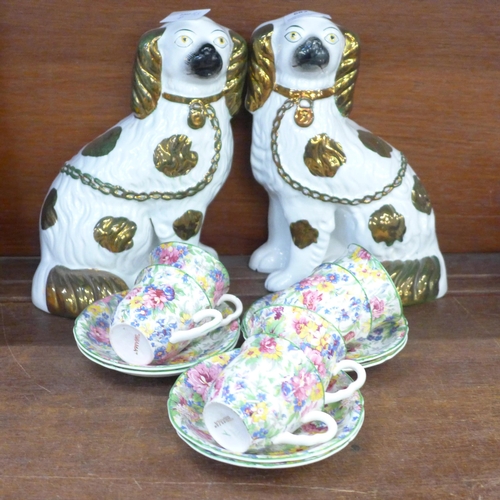 682 - A pair of Staffordshire spaniels and Brama chintz cups and saucers, one cup chipped