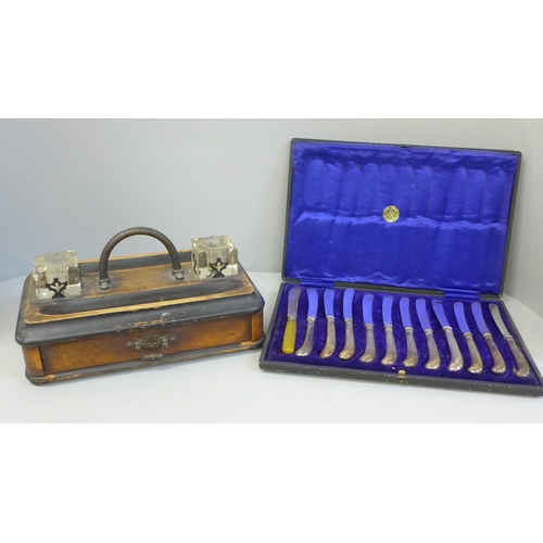 685 - An Edwardian pen stand with double inkwell and a cased set of silver handled pistol grip knives, one... 