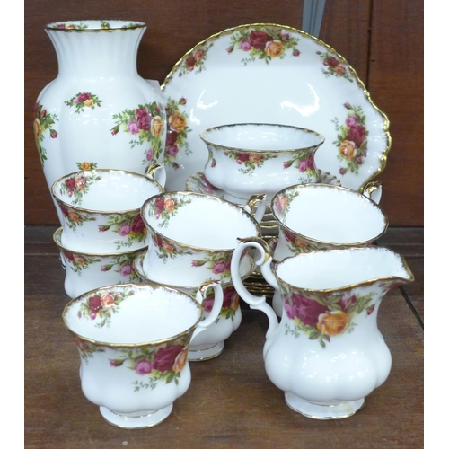 688 - Royal Albert Old Country Roses; seven cups and saucers, five tea plates, bread and butter plate, cre... 