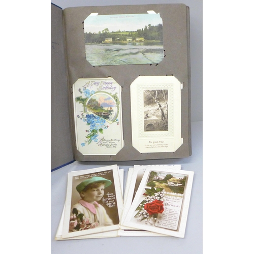 692 - An album of approximately 210 topographical and greetings cards, circa 1900-1910