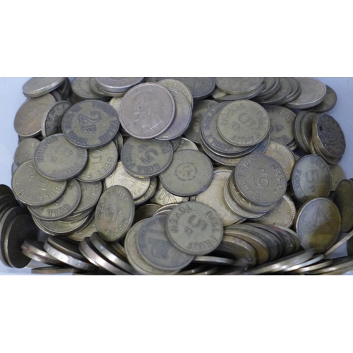 695 - Five tubs of foreign coins and gaming tokens, Bell Fruit and Gemini, 5.041kg