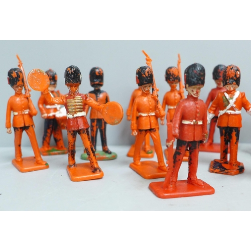 704A - A collection of toy soldiers, marked Lone Star, Crescent Toys and Kellogg's