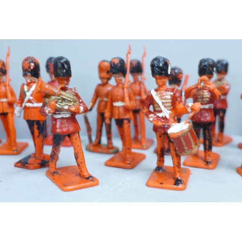 704A - A collection of toy soldiers, marked Lone Star, Crescent Toys and Kellogg's