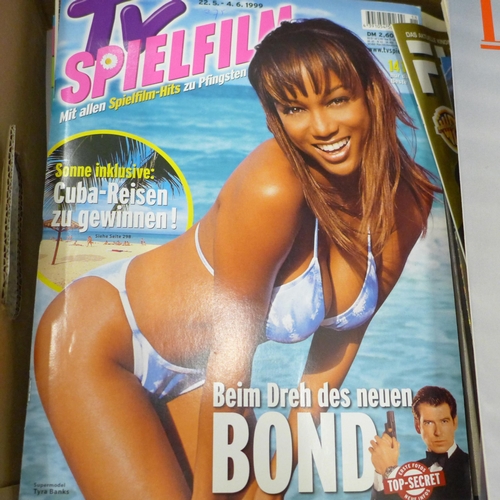 716 - A collection of James Bond magazines, poster, James Bond related Playboy issues, etc.