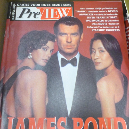 716 - A collection of James Bond magazines, poster, James Bond related Playboy issues, etc.