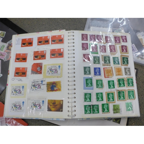 718 - A collection of stamps including two pages of penny reds sorted by plate bumber and loose (130 total... 