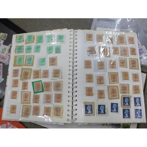 718 - A collection of stamps including two pages of penny reds sorted by plate bumber and loose (130 total... 