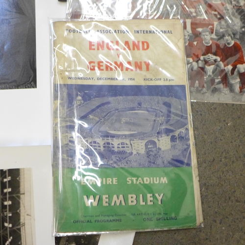 720 - An England World Cup Final replica small football, 1966 programme, photographs including one signed ... 