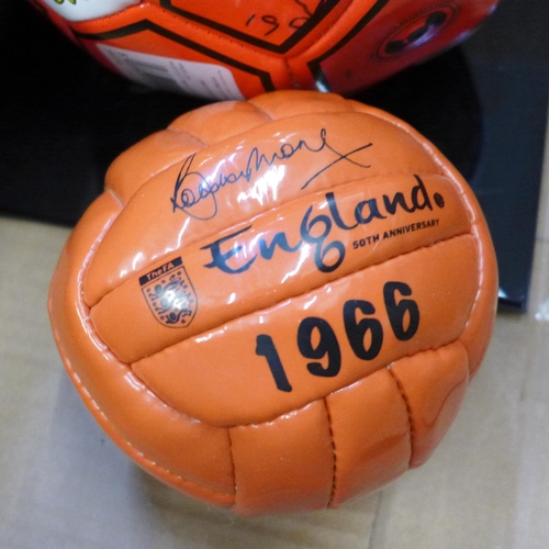 720 - An England World Cup Final replica small football, 1966 programme, photographs including one signed ... 