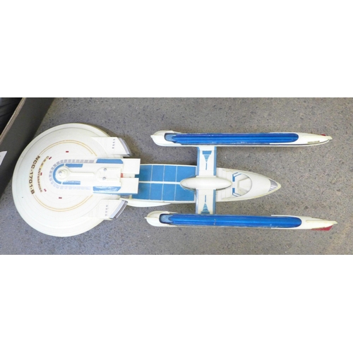 725 - A collection of Star Trek DVDs (full set) and four models of USS Enterprise