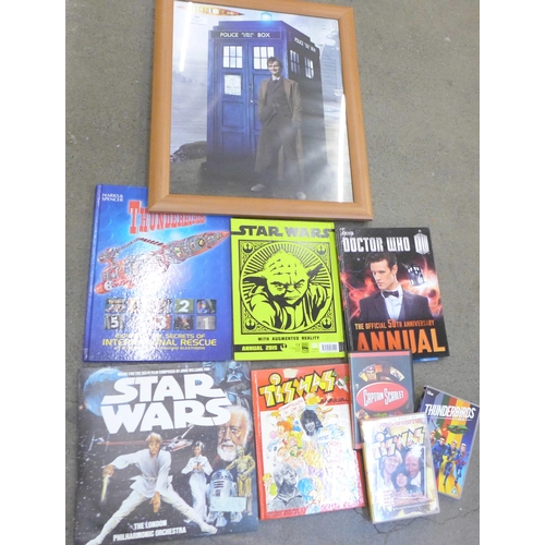 727 - A Dr. Who print, other Dr. Who items, Thunderbirds book, Star Wars record, etc.