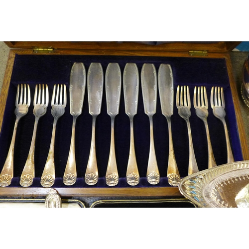 729 - A cased set of pastry forks with silver covered handles, cased fish knives and forks, a plated water... 