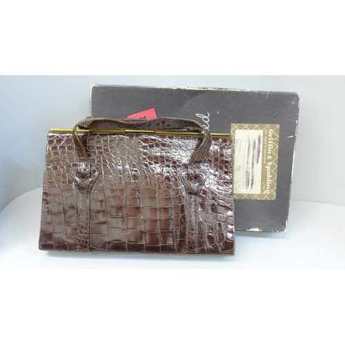 733 - A crocodile skin handbag in a Griffin & Spalding box