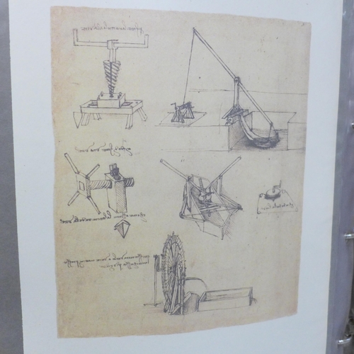 735 - A folio of Leonardo da Vinci prints of drawings and designs